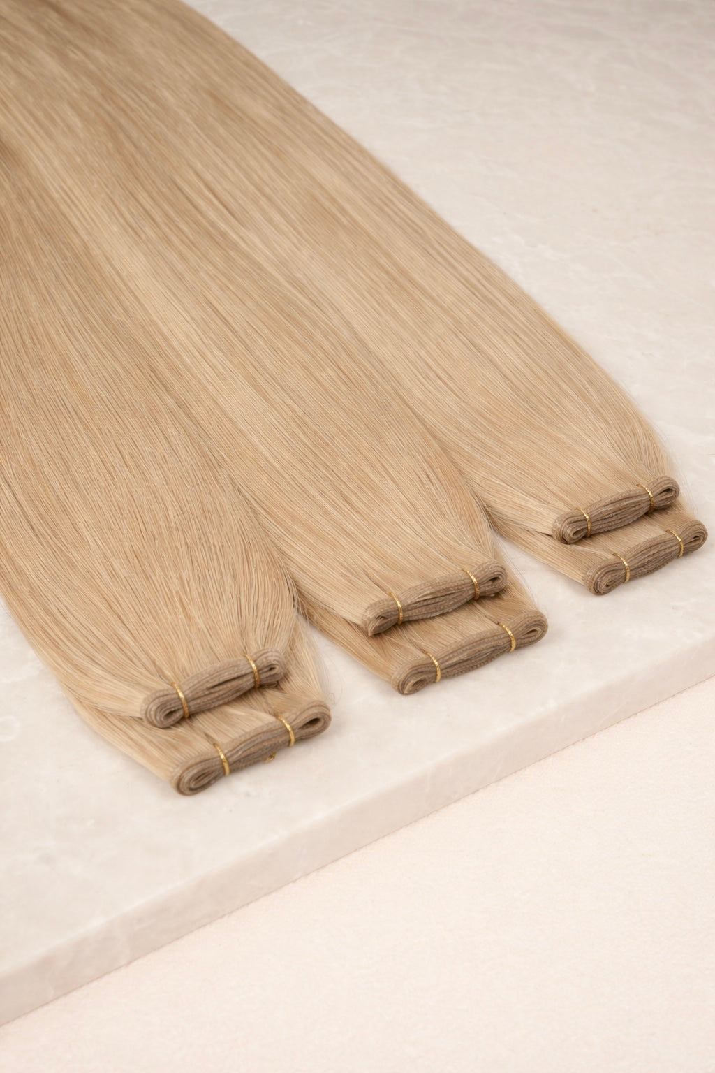 22" Genius Weft Human Hair Extensions. Mid Beige Blonde #DB3
