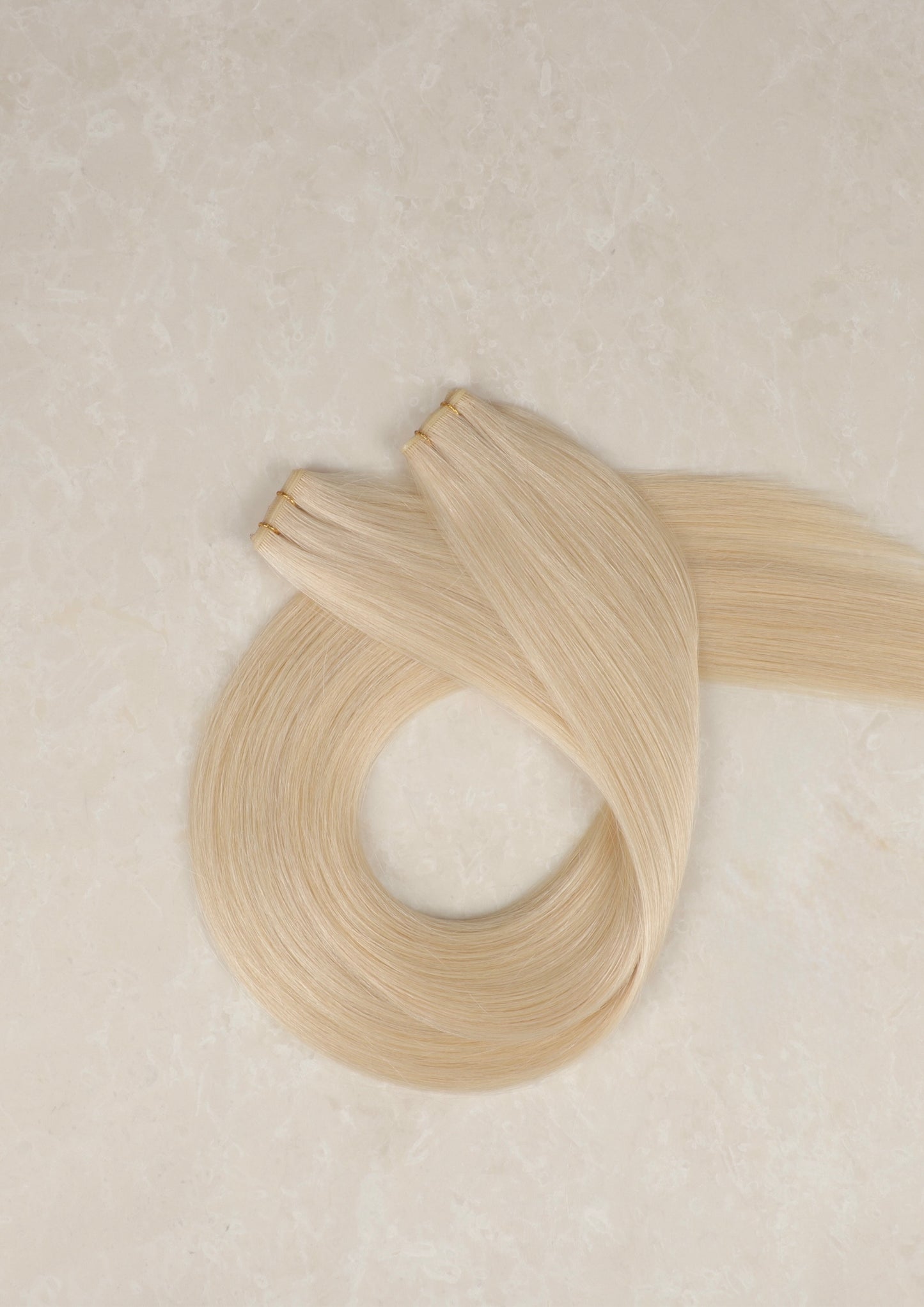 22" Genius Weft Human Hair Extensions. Champagne Blonde #20