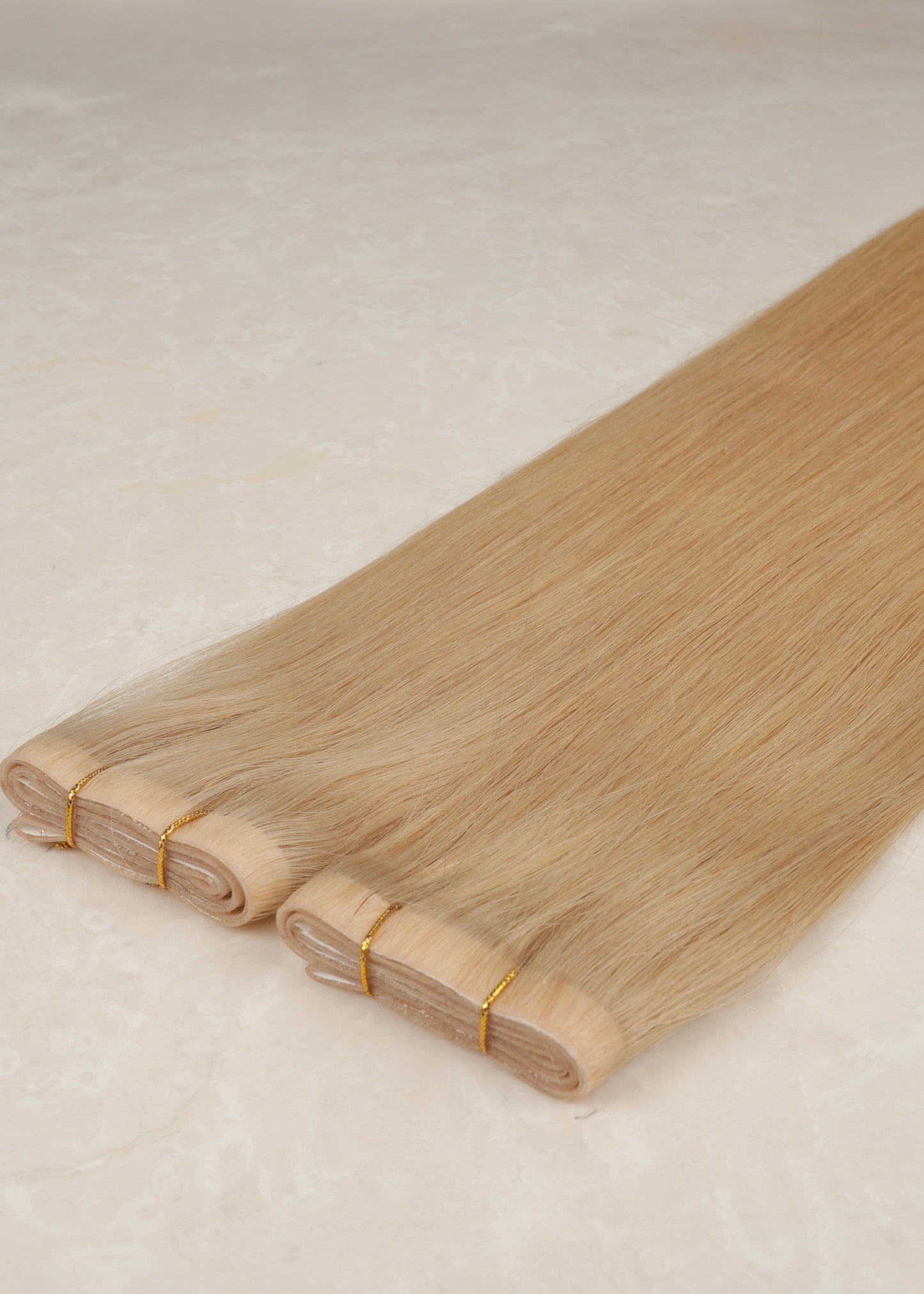 Invisible Tape Weft Human Hair Extensions. Mid Beige Blonde #DB3