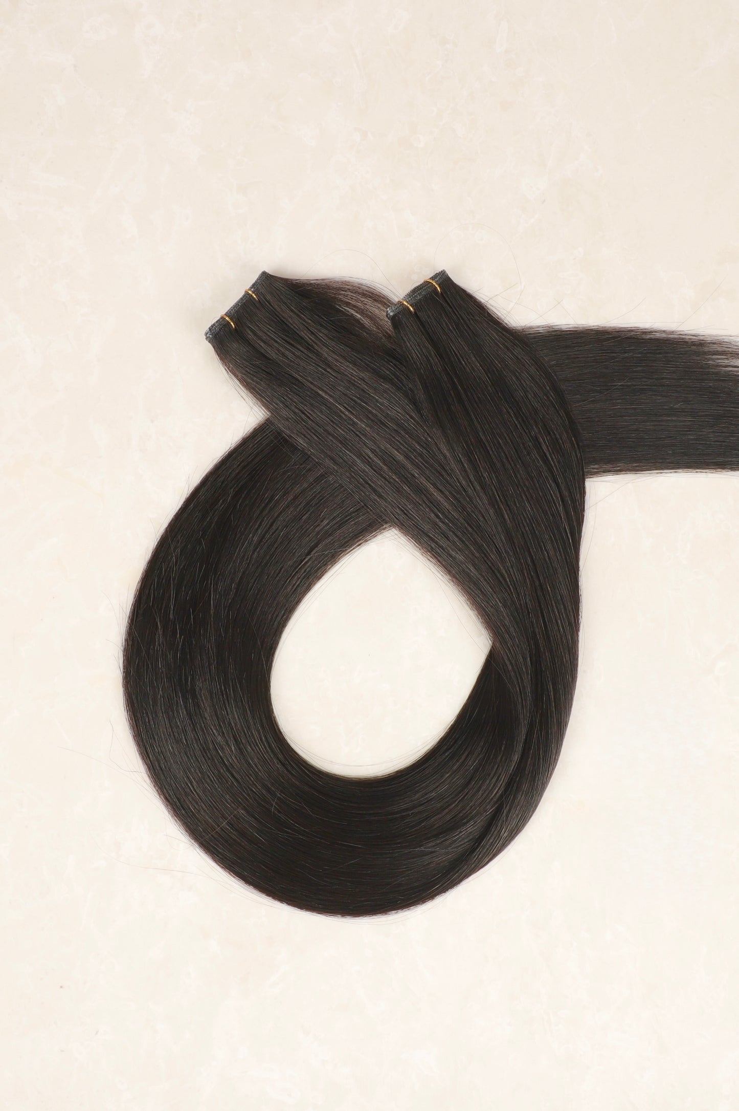 22" Genius Weft Human Hair Extensions. Natural Black #1B