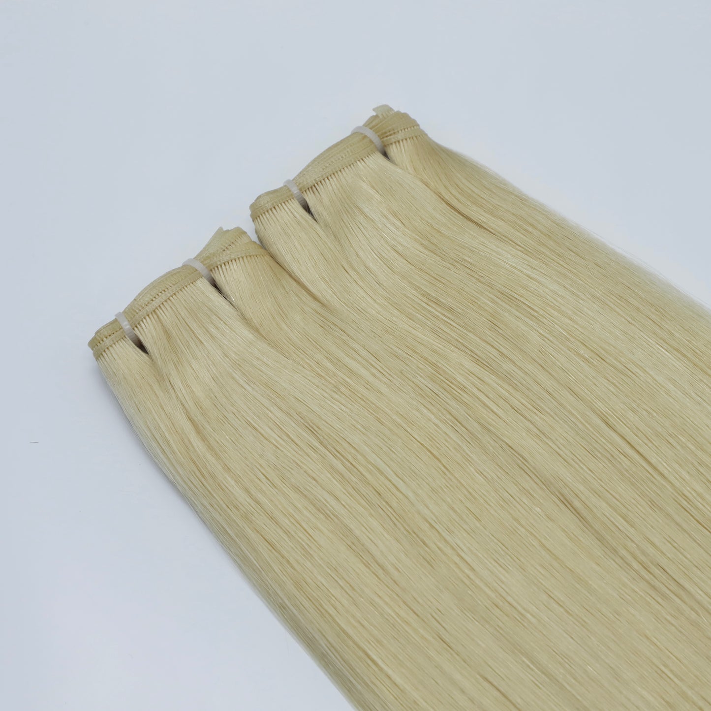 Genius Weft Human Hair Extensions. Luxe Platinum Range